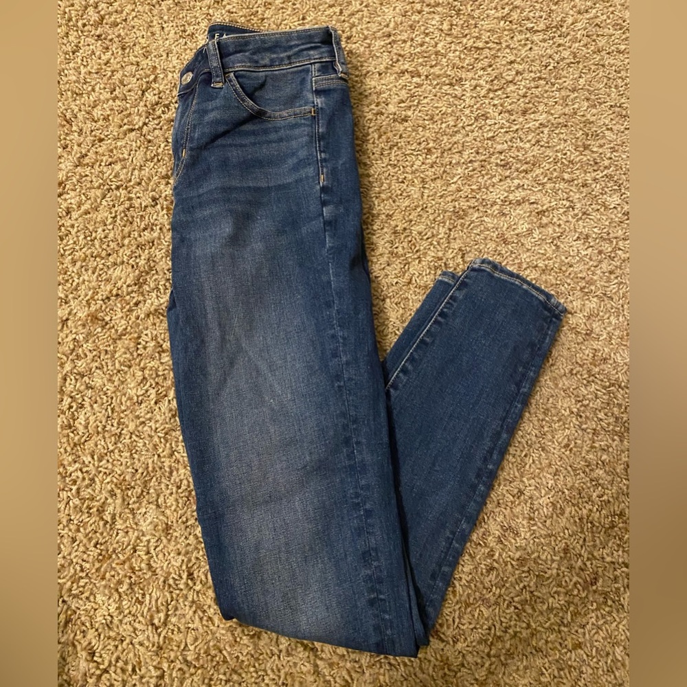 Basic blue jeans, size 4, no rips or holes.